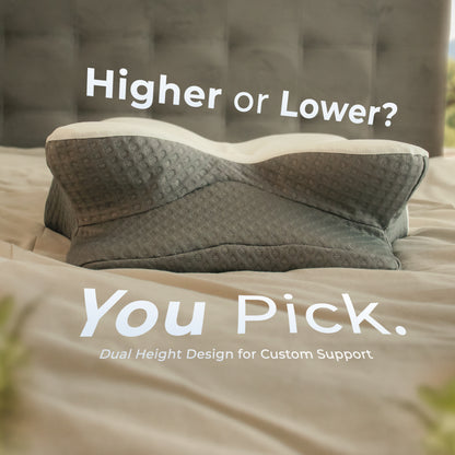 Gray dual-height pillow on a bed with text 'Higher or Lower? You Pick.'